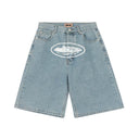 Corteiz Alcatraz Baggy Denim Shorts — Light Wash & Black, front view