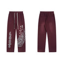 Pantalones de chándal "Wings" de Lost Intricacy - Rojo y verde