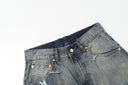 Ancellm Distressed Rust-Stained Jeans — Vintage Wash