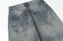 Ancellm Distressed Rust-Stained Jeans — Vintage Wash