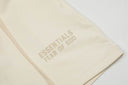 Shorts de felpa Fear of God Essentials — Crema y Negro