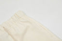 Shorts de felpa Fear of God Essentials — Crema y Negro