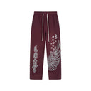 Pantalones de chándal "Wings" de Lost Intricacy - Rojo y verde
