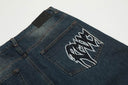 Jeans con parche desgastado "W" de Revenge