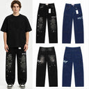 Valley washed black jeans with a rhinestone script and racing patches